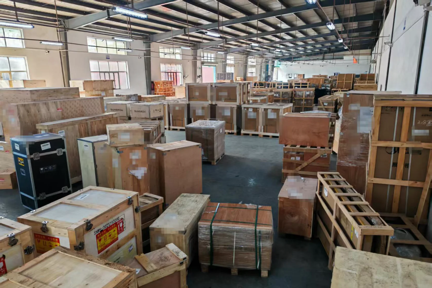 Large packed supplier orders staged with clear separation in the receiving warehouse